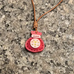 Handmade leather lucky bag keychain charm, red coin purse pendant for women's bags and keys.