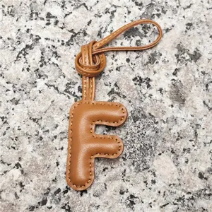 Light brown sheepskin leather letter F bag charm, stylish initial pendant and car accessory.