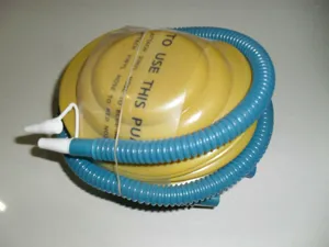 Portable foot air pump with flexible blue hose and yellow pedal for balloons and inflatables.