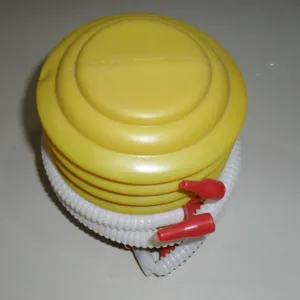 Portable foot air pump main view showing yellow bellows and white hose for balloons and toys.