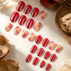 Autumn short press-on nails set false nail art design with red cat eye shimmer and gold foil leaves detail.