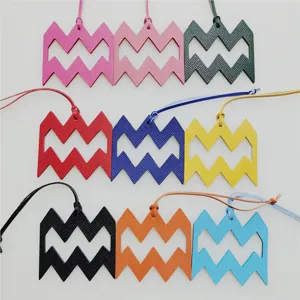 Aquarius constellation leather charm detail showcasing various vibrant colors and hanging cords.