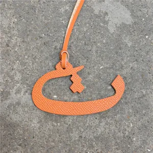 Orange leather Arabic letter bag charm, exquisite textured keychain and car hanging ornament.