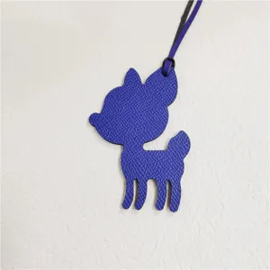 Detailed view of the cute blue leather animal bag charm pendant, stylish accessory.