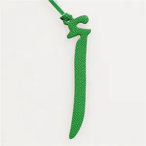 Green leather Arabic letter bag charm pendant key ring accessory fine detail shot