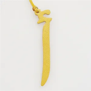 Yellow leather Arabic letter bag charm, elegant designer style bag accessory and keychain.