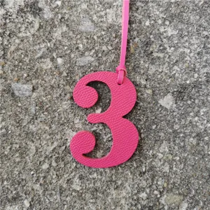 Pink leather number 3 charm detail shot for DIY bag accessories and personalized lucky number decor.