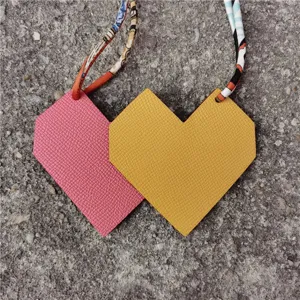 Leather heart shaped bag charm with silk ribbon strap, candy color stylish handbag accessory.