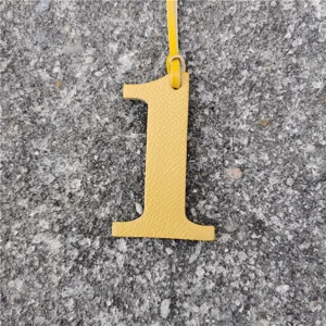 Yellow leather number one bag charm DIY lucky number pendant accessory detail view