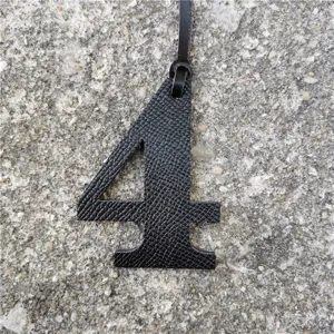 Black leather number 4 bag pendant DIY charm accessory for handbags and keychains style.