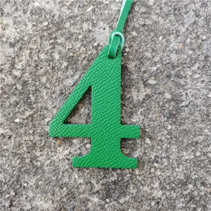 Green leather number 4 bag charm DIY pendant accessory for stylish handbags and purses.