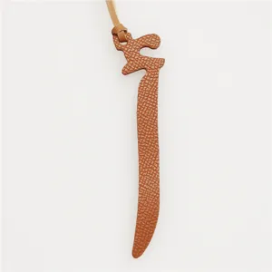 Elegant Arabic letter leather bag charm, stylish brown purse pendant keychain accessory for women.