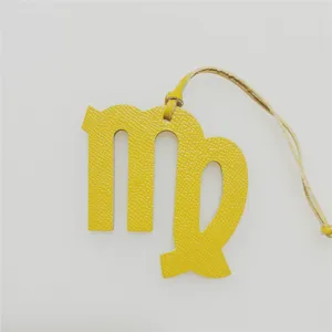 Virgo zodiac sign leather bag charm and car hanging ornament yellow constellation pendant.