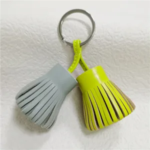 Dual-color leather tassel keychain bag charm, stylish hula skirt style keyring accessory.