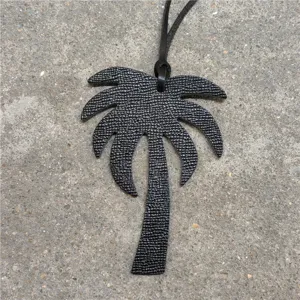 Black leather palm tree bag charm accessory with leather cord for women handbags and car decor.