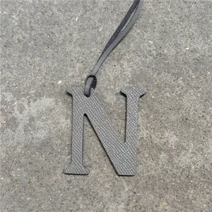 Leather letter N bag charm for women, stylish initial pendant accessory for handbags and purses.