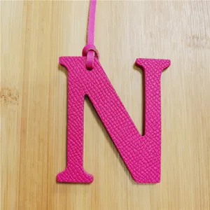 Pink leather letter N bag charm accessory, elegant handbag pendant for women daily use.