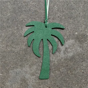 Green leather palm tree bag charm for women, chic handbag accessory or car hanging decor.