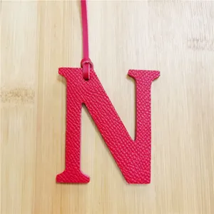 Pink leather uppercase letter N bag charm and stylish pendant accessory for women's handbags.