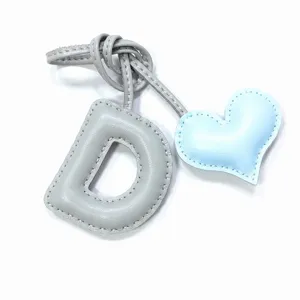 Leather letter D and heart bag charm, handmade grey and light blue keychain accessory.
