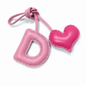 Handmade pink leather letter D and heart bag charm, stylish purse pendant keychain accessory.