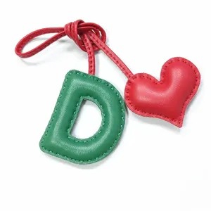 Handcrafted leather letter D and red heart bag charm, stylish handmade purse accessory pendant.