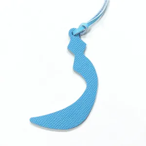 Sky blue leather Arabic letter bag charm, stylish miniature handbag pendant accessory.