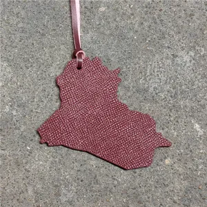 Iraq country map leather bag charm keychain stylish accessory for handbags and backpacks detail shot