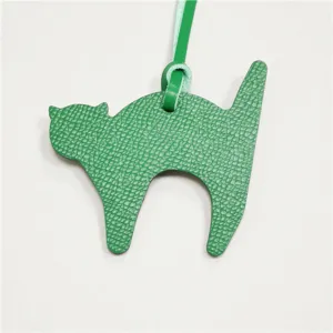 Green leather cat bag charm, cute animal pendant accessory for women handbags and purses.