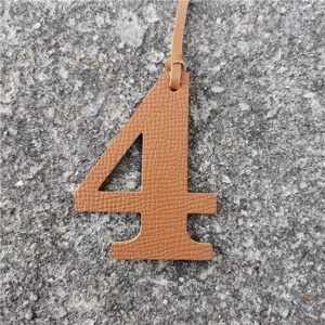 Brown leather number 4 bag charm DIY pendant fashion accessory for stylish handbags and purses.