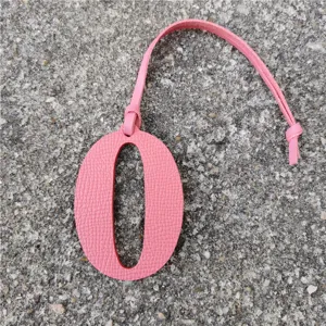 Pink leather number 0 bag charm DIY pendant fashion accessory for handbags and packs.