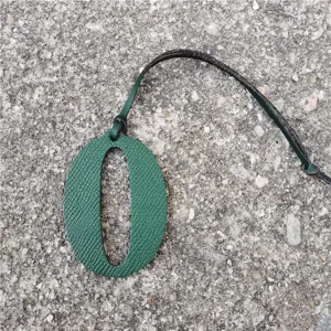Green leather number 0 bag charm detail, textured leather diy pendant hanging accessory.