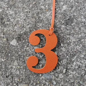 Orange leather number 3 charm bag pendant DIY hanging decoration accessory detail view