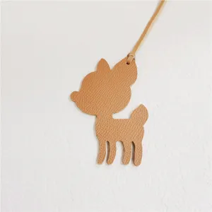 Cute deer shape leather bag charm in camel color, premium leather strap handbag accessory.