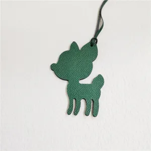 Green leather deer bag charm detail view, cute animal pendant accessory for women