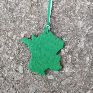 Green France map shape leather bag charm and stylish car hanging ornament detail.