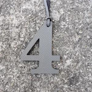 Grey leather number 4 bag charm, stylish DIY pendant and handbag accessory with strap.