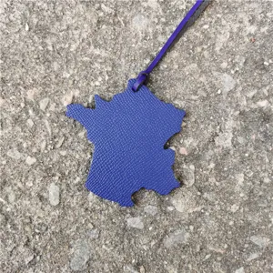 Blue leather France map bag charm, stylish car pendant with fine grain texture and strap.