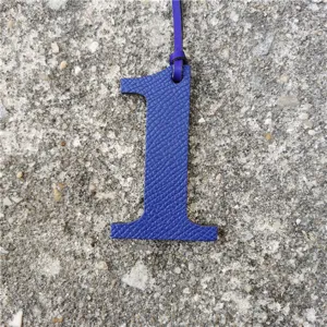 Blue leather number 1 bag charm, stylish DIY keychain and decorative pendant accessory.