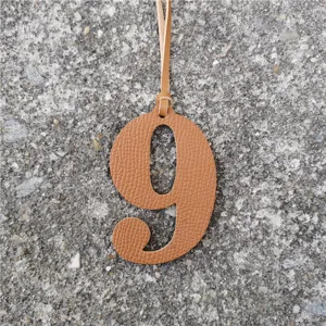 Leather number 9 bag charm DIY pendant accessory for personalized stylish handbags and keys.
