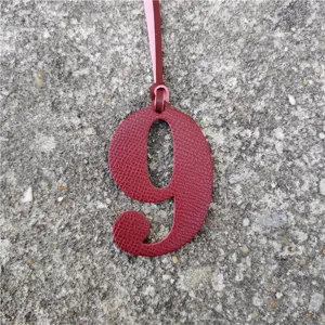 Red leather number 9 bag charm, lucky DIY pendant accessory for handbags and packs.
