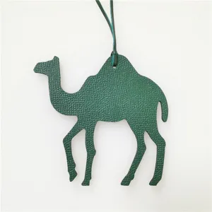 Green leather camel bag charm, stylish animal handbag accessory for women and girls daily use.