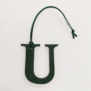 Dark green leather uppercase letter U bag charm with strap, initial pendant accessory.
