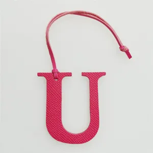 Pink leather letter U bag charm detail view, initial alphabet charm for purses and handbags.