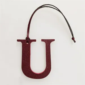Leather letter U bag charm with strap, initial pendant accessory for handbag decoration.