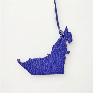 Genuine leather UAE map shape bag pendant women handbag charm stylish accessory blue color.