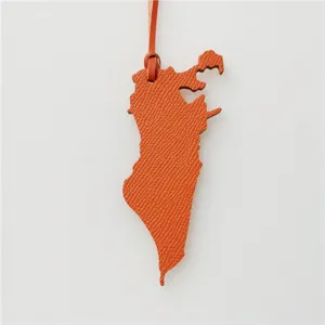 Bahrain carte forme cuir sac charme orange pendentif sac a main stylise accessoire