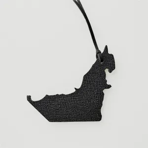 Stylish black leather UAE map bag charm pendant, perfect women handbag accessory for daily use.