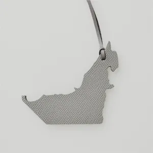 Genuine leather bag charm featuring UAE map shape in grey, elegant leather pendant for handbags.