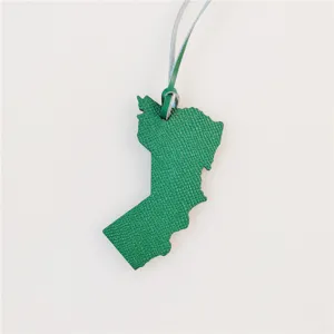 Green leather Oman map bag charm with strap, elegant leather pendant for handbags.